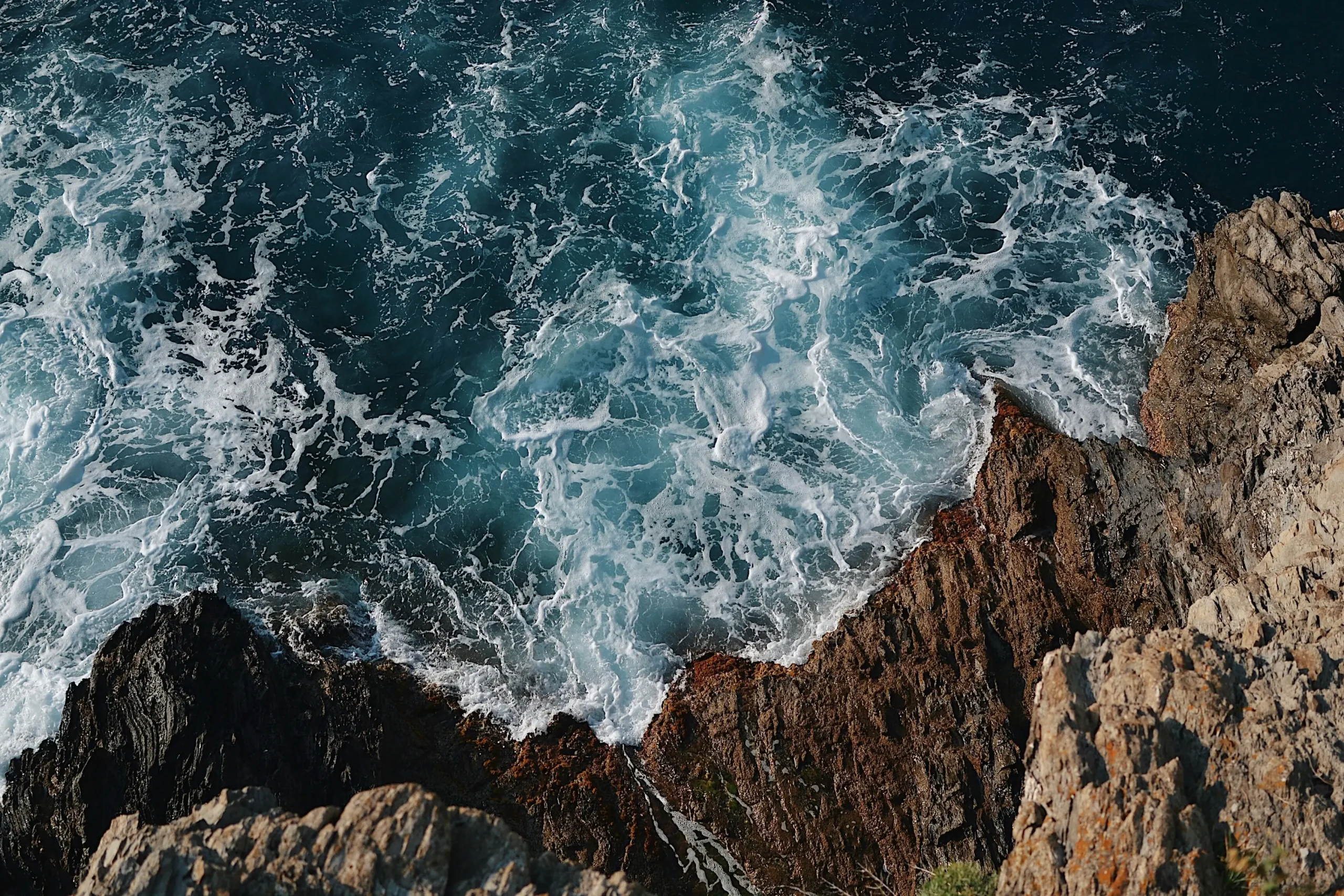 The erosion of rocks by the sea is a symbol of real, gradual impact over time